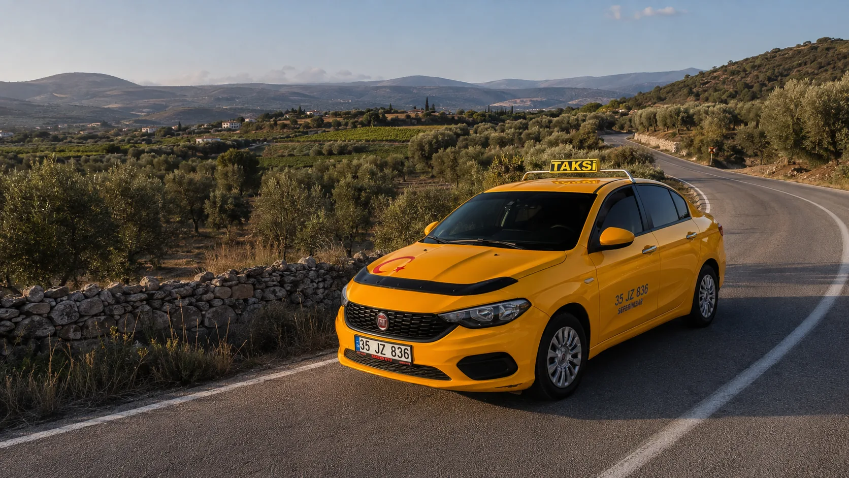Bademler üzerinden geçen virajlı dağ yolu ve köy geçişi